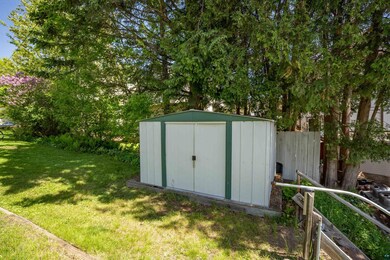 View of outdoor structure with a lawn