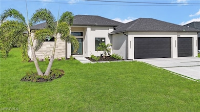 View of front of home with stucco siding, an attac