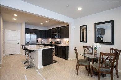 Kitchen featuring stainless steel appliances, dar