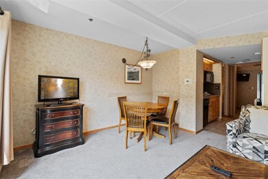 Dining area featuring carpet floors, baseboards