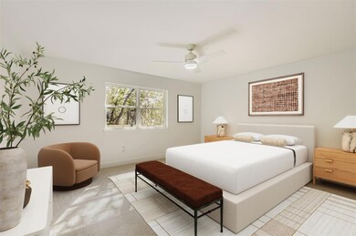 Bedroom featuring a ceiling fan and carpet flooring