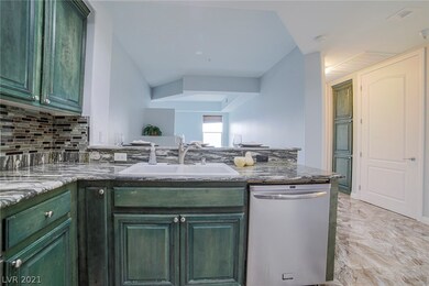 Kitchen overlooks the living area for an open conc
