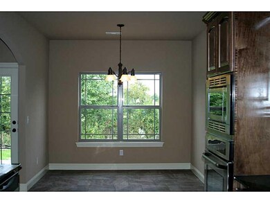 Dining Room. The kitchen features an eat-in dining