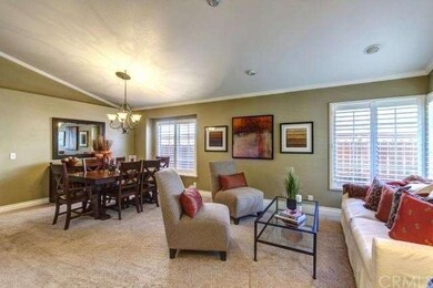 VIEW OF THE LIVING AND DINING AREA. IT FEATURES LO