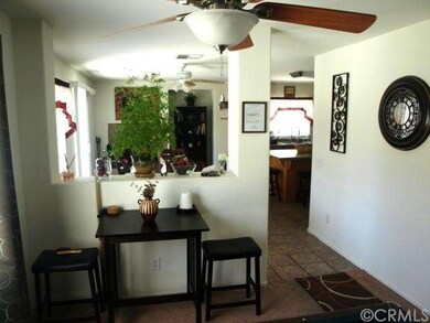 Entry to family room and kitchen with tile floorin