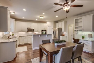 The open floor plan between the kitchen, eat-in area, and family room makes entertaining fun and easy!