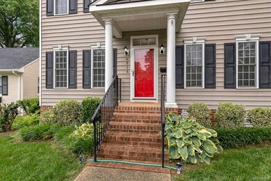 Walk up to a covered porch with newly painted front door and new light fixtures. Note the Transom over the door!