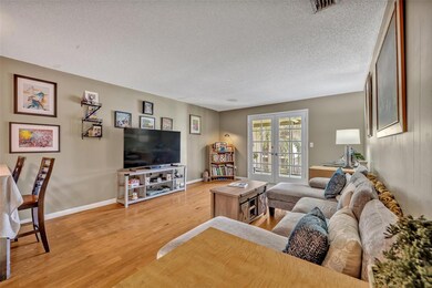 Just off the living room is a screened patio for additional living space.