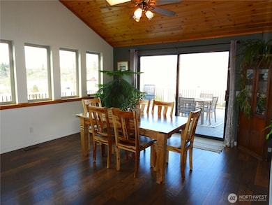 Large dining room connecting to wraparound deck.