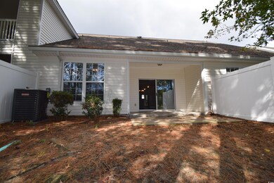 Back of property with a patio and cooling unit