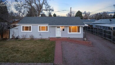 Ranch-style house at twilight featuring upgraded s