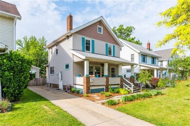 This classic colonial offers a large front porch, perfect for watching the world go by.