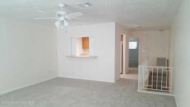 Living facing kitchen w/bar