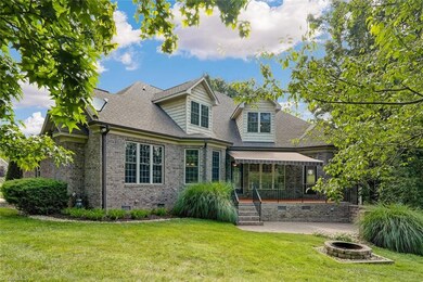 Upper patio is poured concrete and has a remote control motorized Sunbrella awning.  Lower patio offers additional outdoor living space with beautiful views of the lush landscaping.  This backyard is very private.