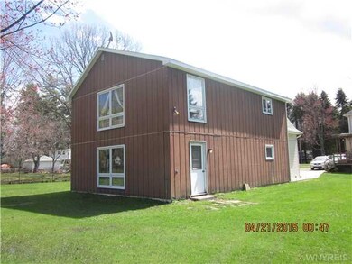 Exterior Back. Back of oversized garage apt.