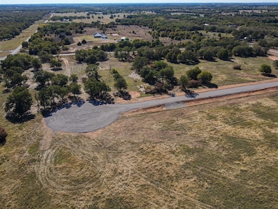 Birds eye view of property featuring a rural view