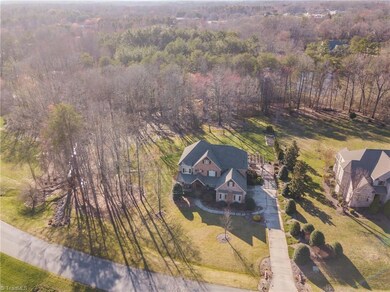House sits on 2.27 acre private lot that boasts natural area, as well as cleared space! Fully fenced back yard and access to trails make this lot a premium!