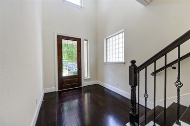 Walk right into a bright entryway with dark hardwo