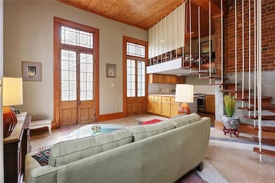 Living Room faces courtyard and french doors, with