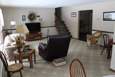 The living room/dining room welcomes you when you 