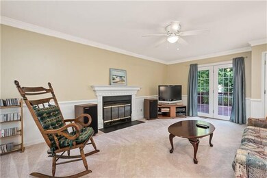 Spacious living room with gas fireplace leads to t