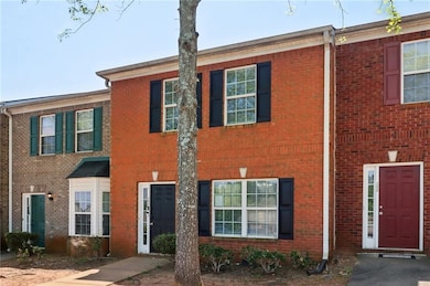 View of property with brick siding