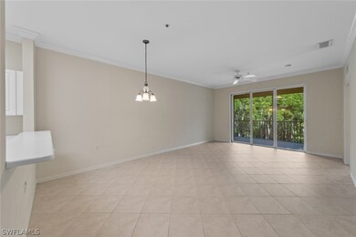 Tiled spare room featuring ceiling fan with notabl