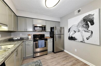 Kitchen with light hardwood / wood-style flooring,