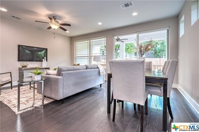 Beautiful dining area with rich hardwoods, open to