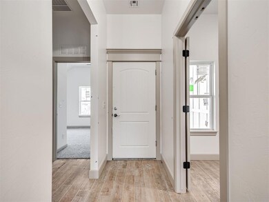 Foyer featuring plenty of natural light and light 