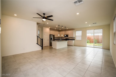 Unfurnished living room with ceiling fan, recessed