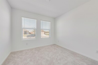 Unfurnished room with light colored carpet