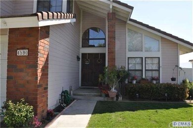 Inviting front porch with double door entry