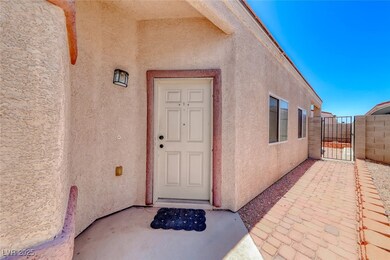 View of exterior entry featuring stucco siding and