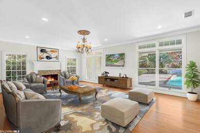 Virtually staged den overlooking pool