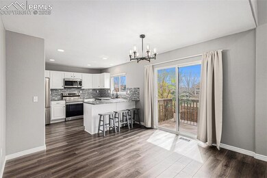 Kitchen featuring a peninsula, visible vents, white cabinetry, and appliances with stainless steel finishes