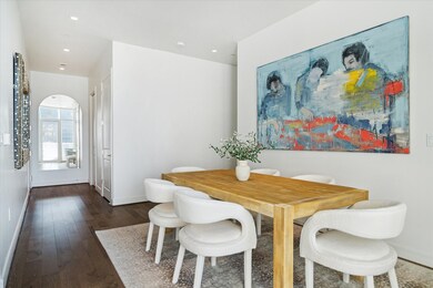 This unit features wood flooring in the common spa