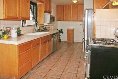 Kitchen has Stainless Appliances, Tile Floor & Cou