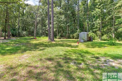 Backyard view with shed that remains with the home