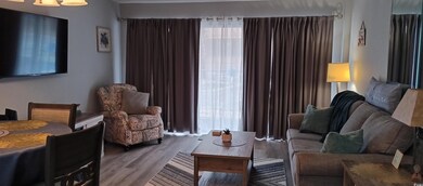 Living room featuring hardwood / wood-style floori