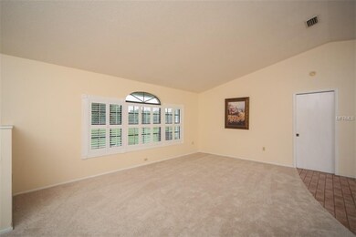 Large living room and plantation shutters.