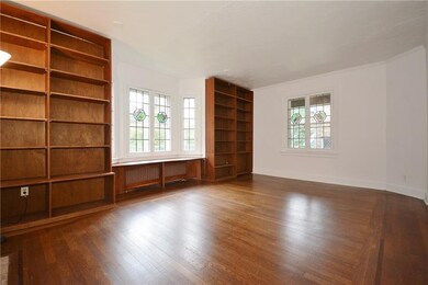 Large living room with a beautiful stained glass b