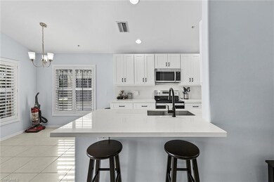 ORIGINAL PHOTO: Kitchen with a breakfast bar area,