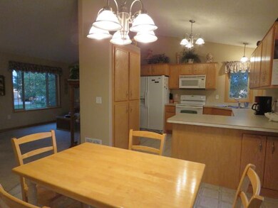 The dinette opens to the kitchen and living room f