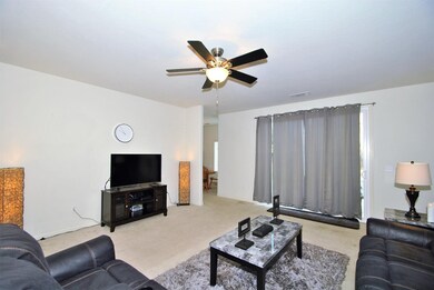Great Room is spacious and has lighted ceiling fan