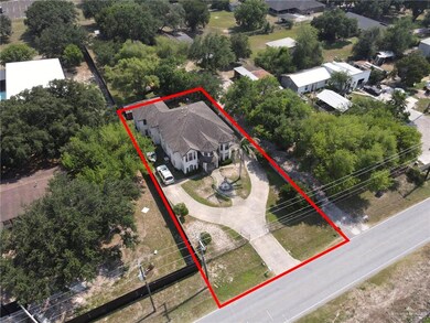Aerial view of residential area featuring property boundaries highlighted
