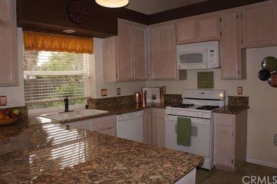 Beautiful granite countertops in the spacious kitc