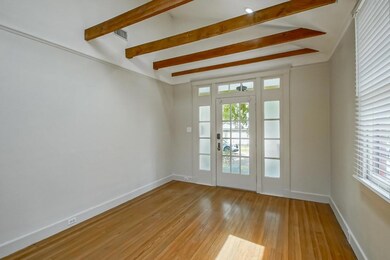 Wonderful living room with high ceilings & exposed