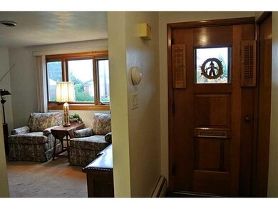 Living Room. Front door, coat closet, and entry to