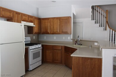 Kitchen with white appliances, under cabinet range